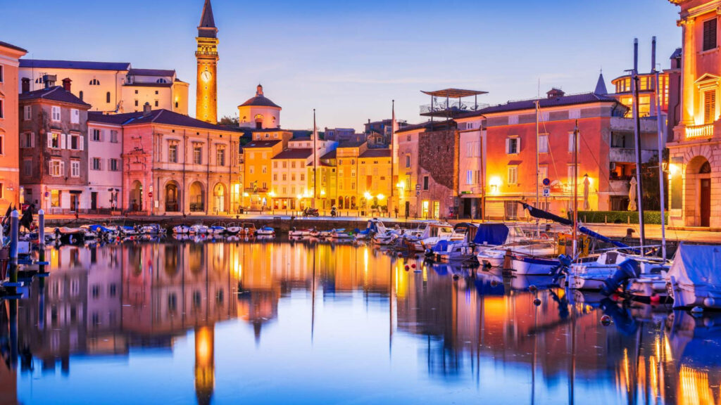 Piran-at-night-hutterstock__ScaleMaxWidthWzE5MDBd